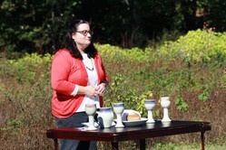 Lisa Shrott leads worship in the Columbia Theological Seminary Community Garden with student group SAGE—Sustaining Attention to God's Earth. 