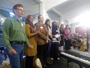 Members of the SPC Choral Project, from left to right: Rick Ufford-Chase, Tasnim Islam, Cass Shaw, Zainab Wassef, Aude Isimbi, Sarah Henkel, Amy Dalton, Kitty Ufford-Chase.