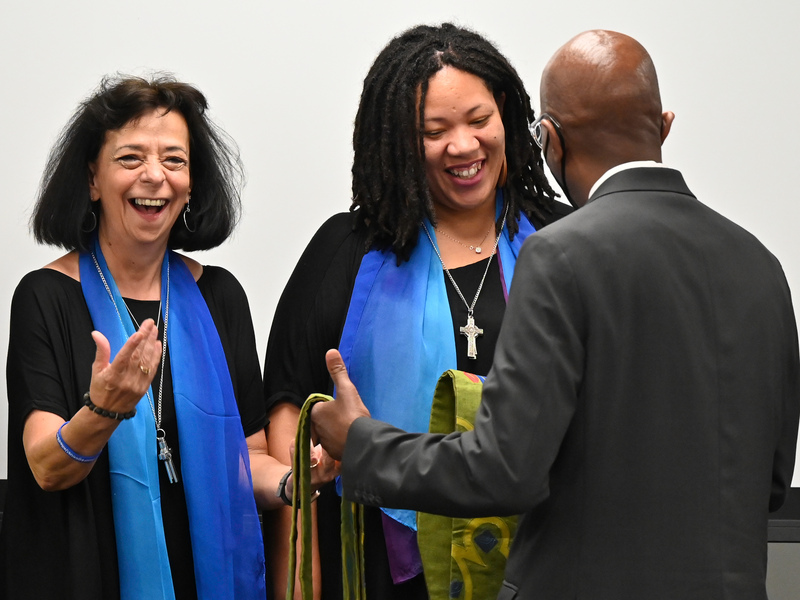 Ruling Elder Elona Street-Stewart stands with Rev. Ruth Faith Santana-Grace and Rev. Shavon Starling-Louis, Co-Moderators of the 225th General Assembly, as Stated Clerk Rev. Dr. J Herbert Nelson, II presents them with stoles at the Moderators election on the first day of the Assembly, June 18, 2022, at the Presbyterian Center in Louisville, Kentucky. (Photo by Rich Copley)