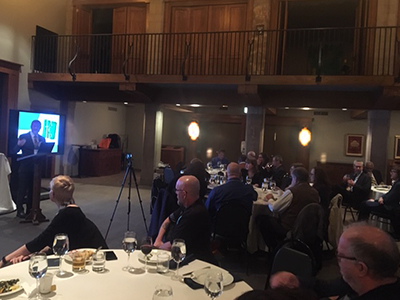 Rev. Gregg Brekke, executive director of the Associated Church Press, speaks to conference attendees during an awards banquet in Chicago.