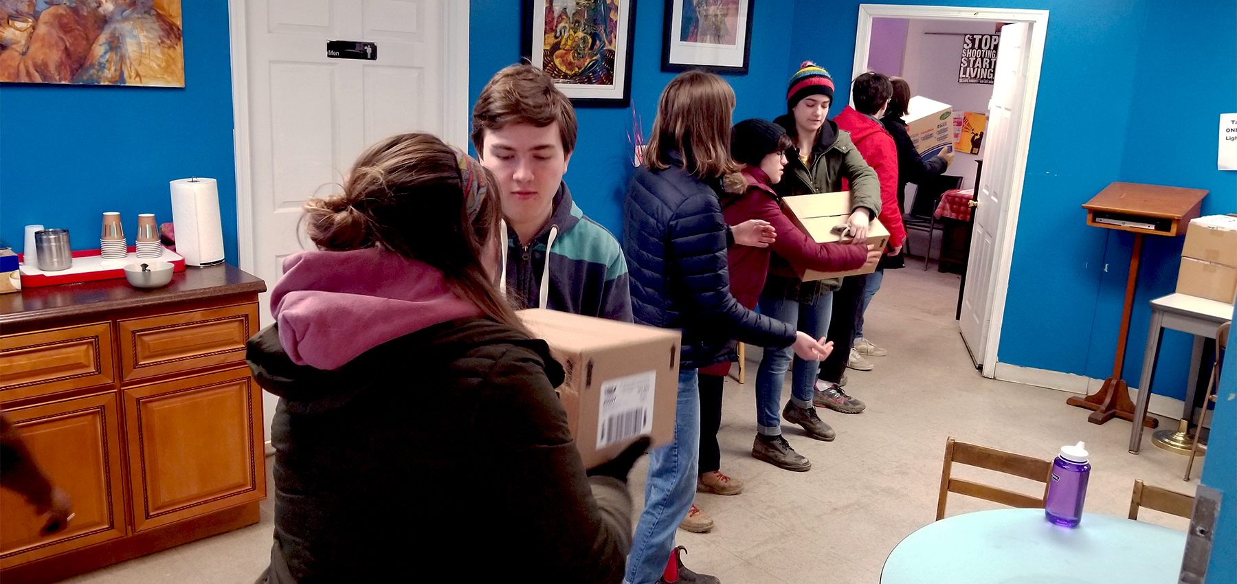 Youth from State College Presbyterian Church move boxes of food at Amazing Grace Lutheran Church in Baltimore earlier this year as part of the Hands and Feet initiative. Photo provided.