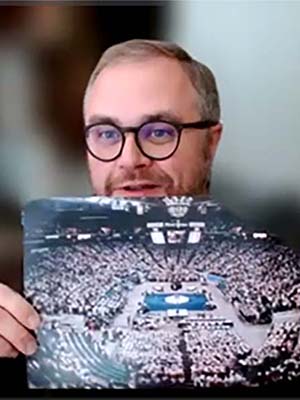 COGA’s Andy James holds a picture from the 210th General Assembly in Charlotte, N.C. 