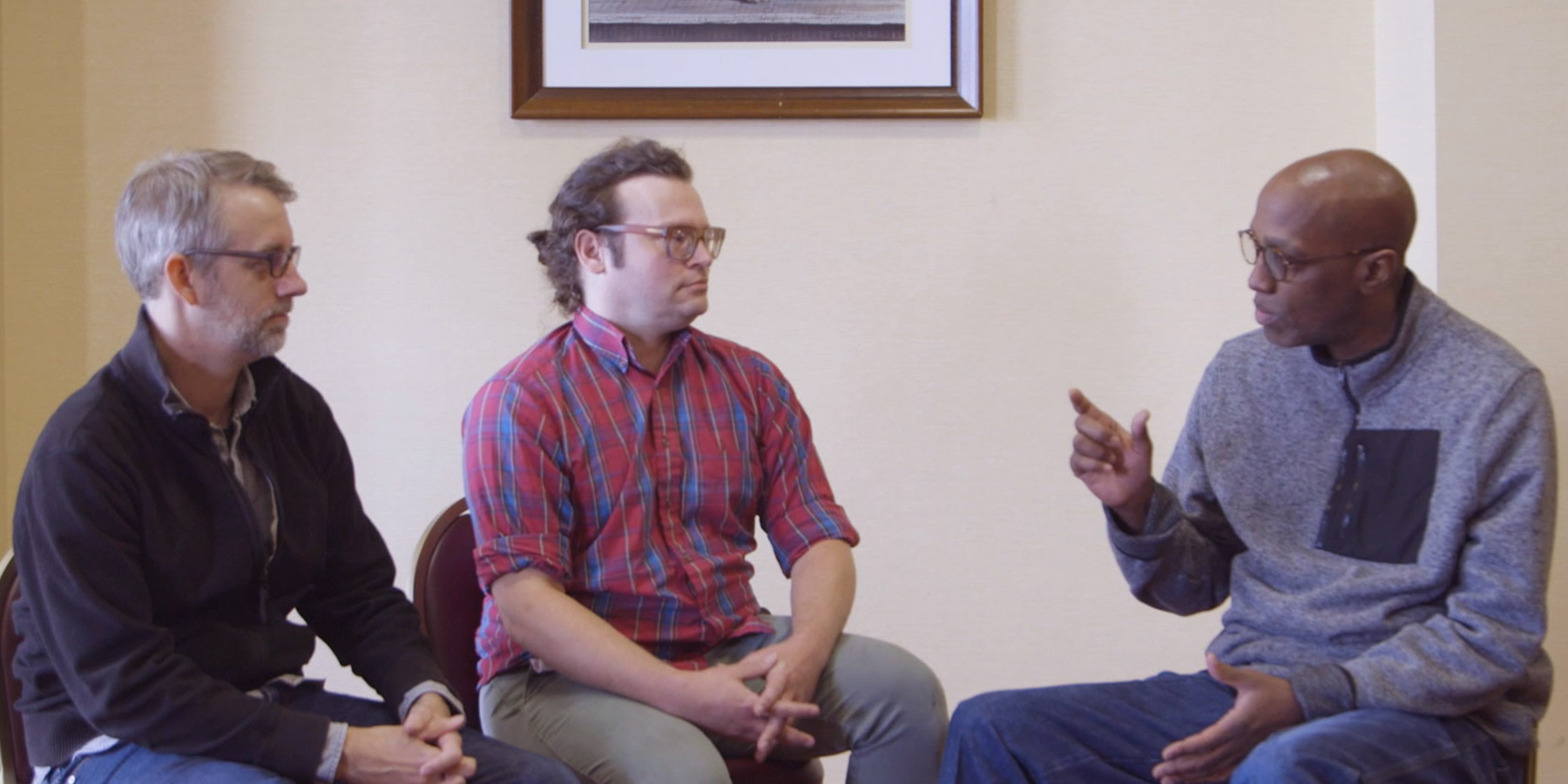 Fred Tangeman (left) and David Staniunas with the Presbyterian Historical Society, appear with the Reverend Dr. J. Herbert Nelson, II, on Coffee with the Clerk. Photo by Randy Hobson.