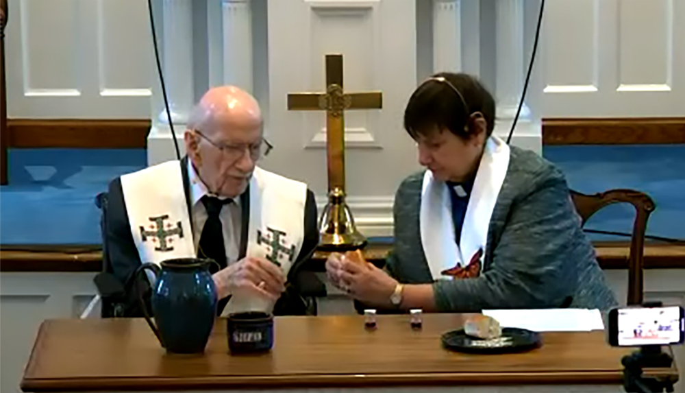 The Rev. Dr. Fletcher and the Rev. Dr. Debby Brincivalli take part in communion during the presbytery meeting. Photo provided.