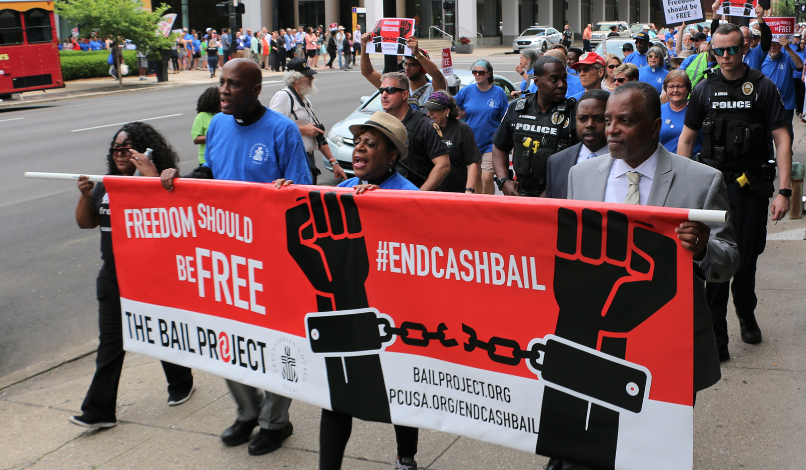 More than 250 people marched in Louisville in June 2019, to end cash bail. Left to right, Shameka Parrish-Wright of The Bail Project; the Rev. Dr. J. Herbert Nelson, II; the Rev. Dr. Diane Moffett; and J. Phillip Thompson, deputy mayor of New York City. Photo by Tammy Warren