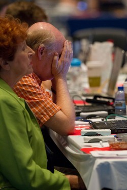 Commissioners pray during the Thursday afternoon plenary session at the  221st General Assembly (2014) of the PC(USA) in Detroit, MI on Thursday, June 19,  2014.