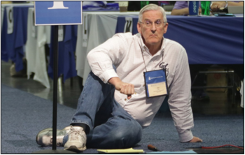 Tim Tripp waits to speak during plenary