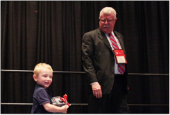 Gradye Parsons and grandson Dylan thank those gathered at the group dinner.