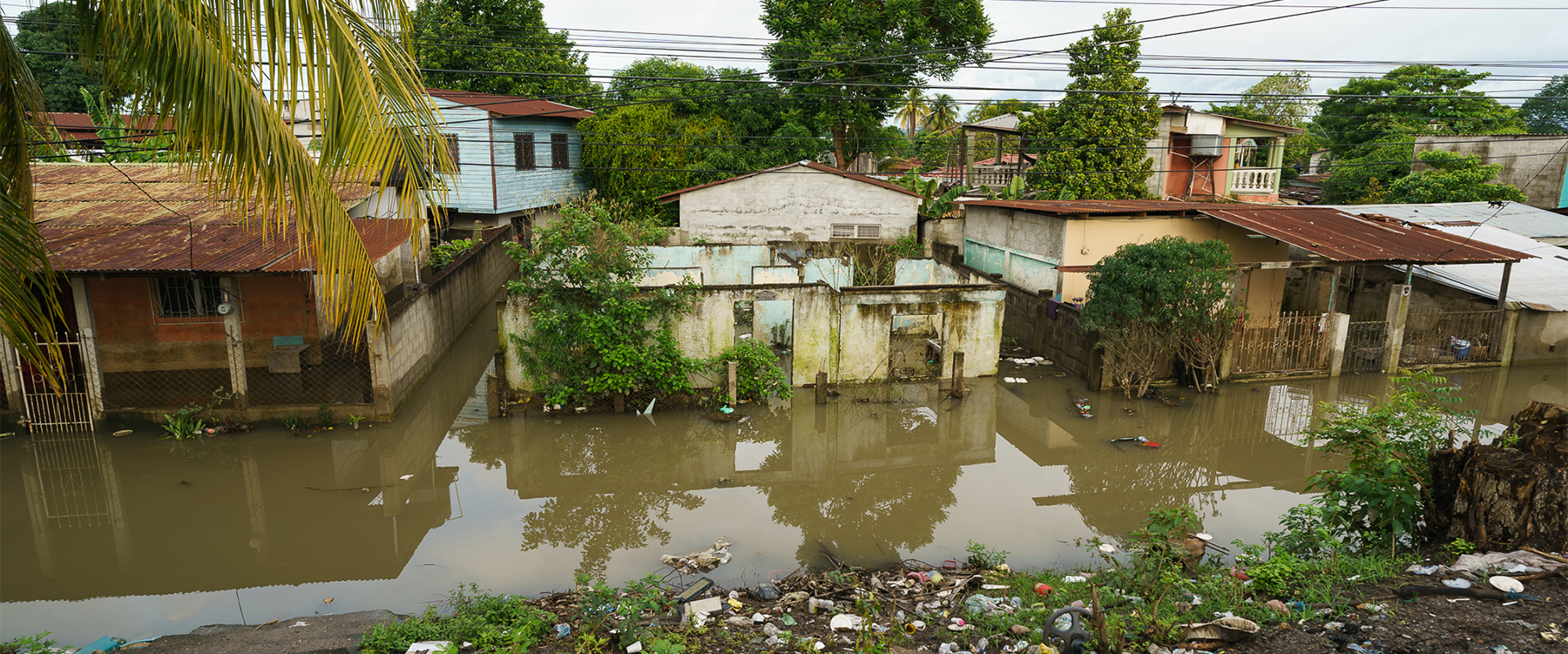 Destroyed homes in the flooded town of La Lima, Honduras. Photo By Gregg Brekke. 