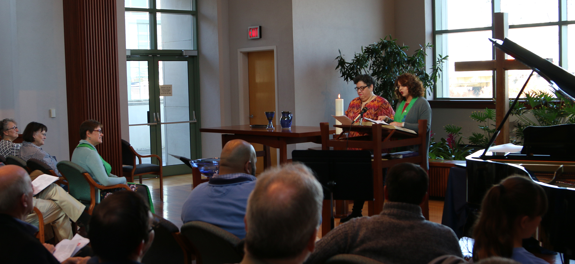 With translation help from the Rev. Marissa Galvan-Valle of the Presbyterian Publishing Corp., Ruling Elder Vilmarie Cintrón-Olivieri, co-moderator of the 223rd General Assembly, preaches in the chapel at the Presbyterian Center in Louisville Friday during opening worship at the Moderators’ Conference. Photo by Randy Hobson