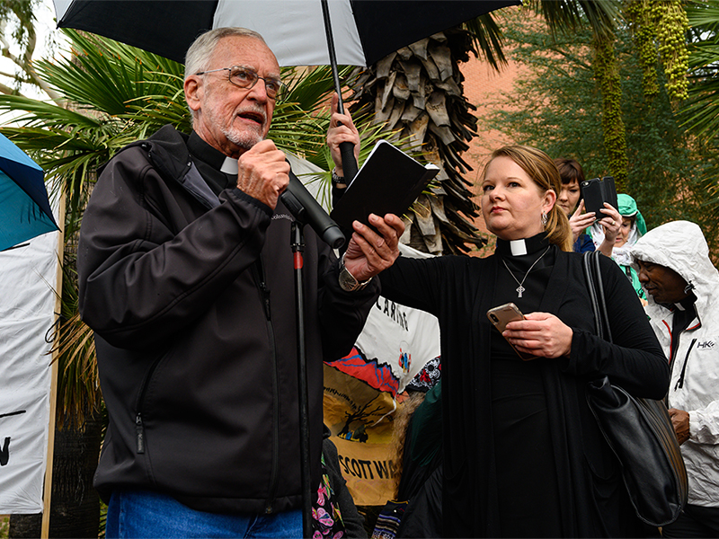 Human Rights Activist and Presbyterian Pastor John Fife speaks at the gathering alongside Rev. Alison Harrington, Pastor of Southside Presbyterian Church in Tucson. Photo by Gregg Brekke. 