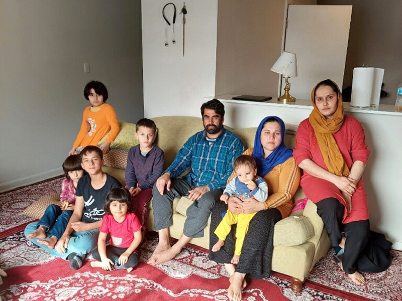 Mohammad with family members, courtesy of Raees Amiri and Martha Nichols-Pecceu.