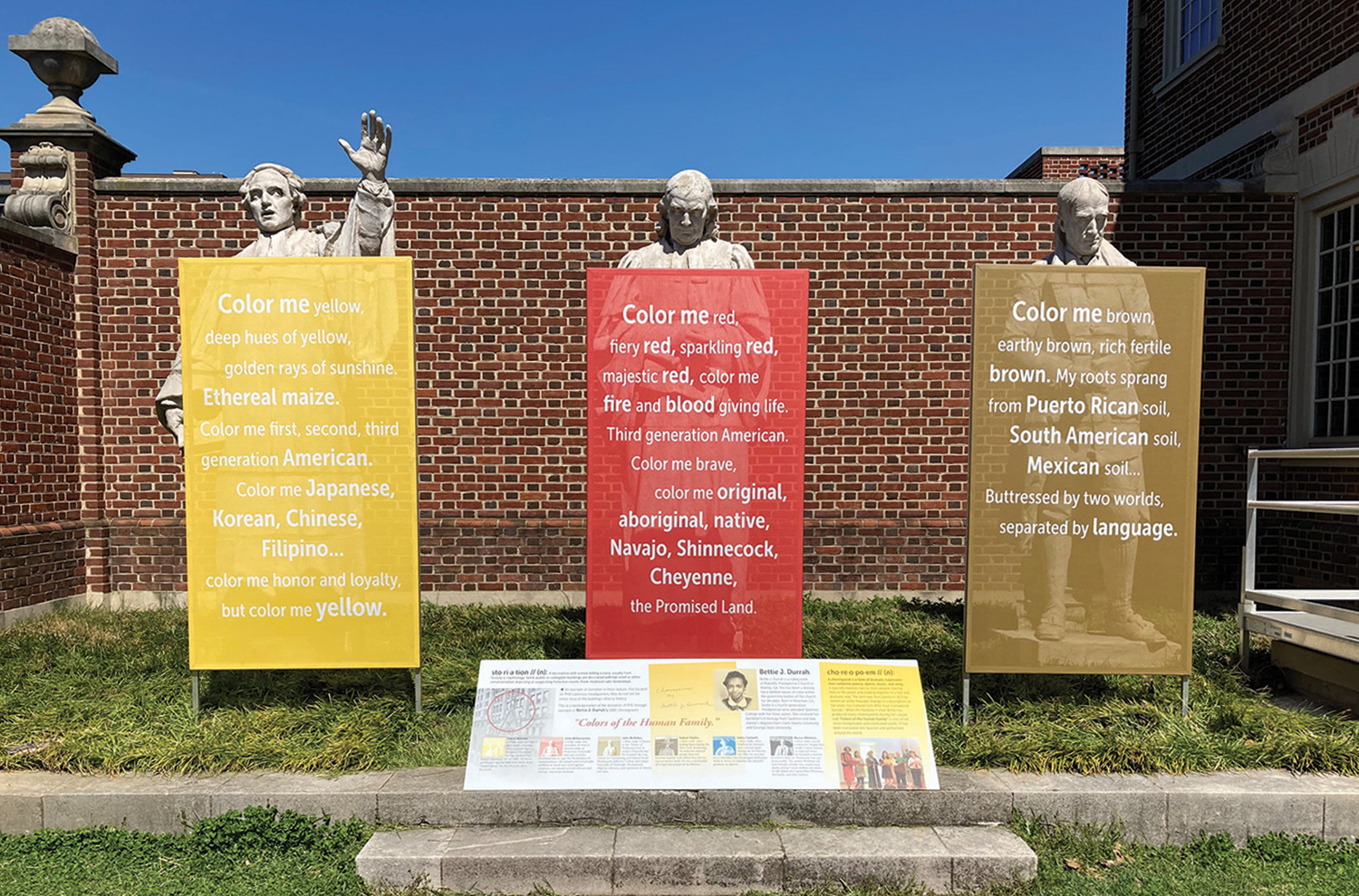 The outdoor exhibit includes additional information by the statues. Photo by Kristen Gaydos.