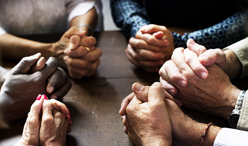 Group of people in prayer