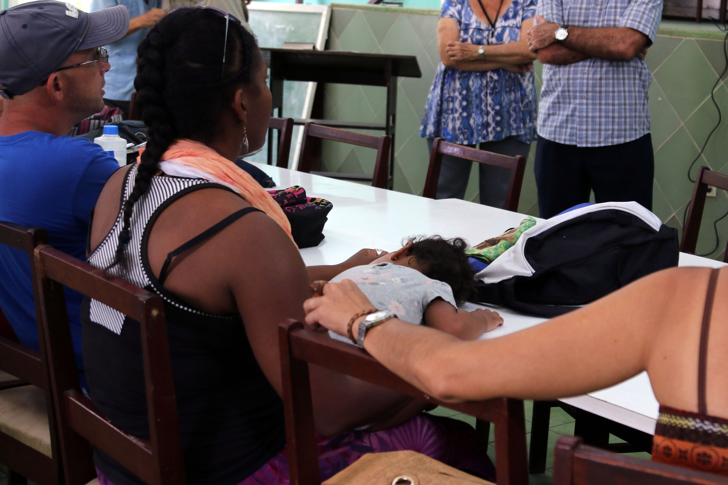 Hiromis listens while her daughter, Gita, naps during a lecture at ISECRE.