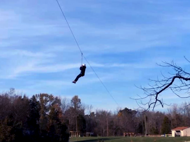 Vilmarie Cintron-Olivieri, Co-Moderator of the 223rd General Assembly (2018) of the PC(USA), rides the zipline during the weekend retreat. Photo by Andrew Hartmans.